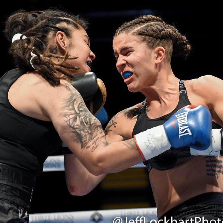 gjwb ambassador and professional fighter: carolyn redmond fighting against her opponent 