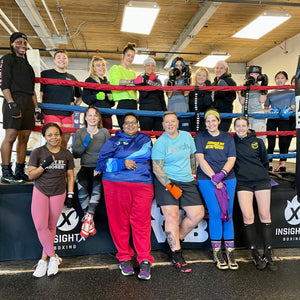 female boxers inside a boxing ring 