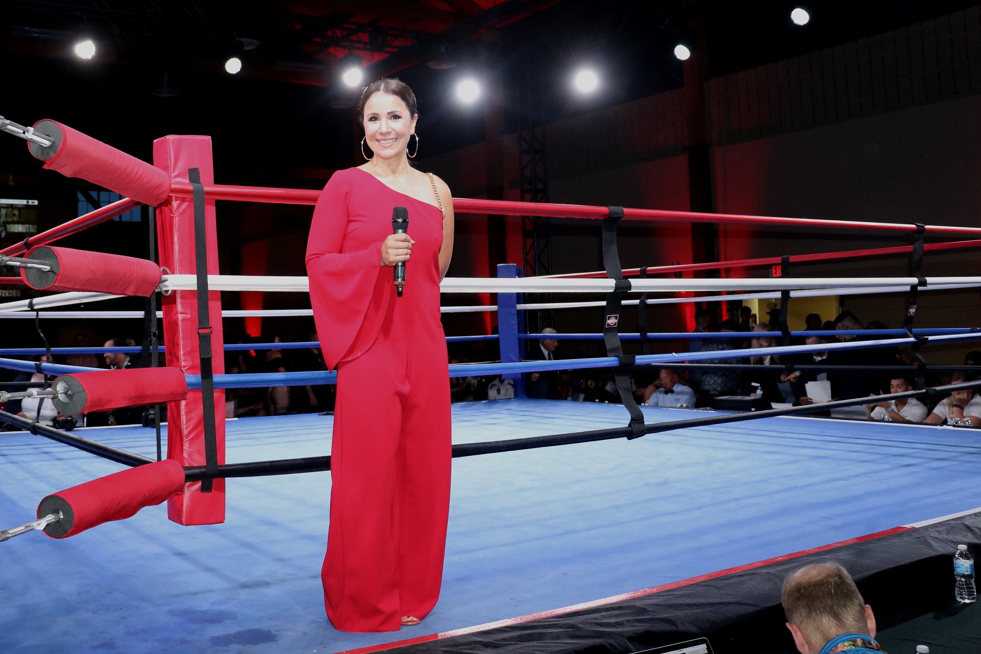 Yvette Raposo - female ring announcer in the ring with a microphone
