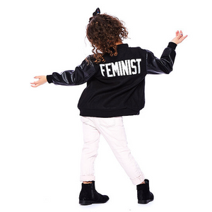 young girl sporting a FEMINIST saying varsity leather kids jacket in black 