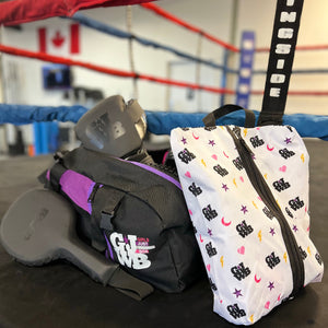 purple and black gym bag in a boxing ring with gloves, coaches paddles and small shoe bag with girls just wanna box logo